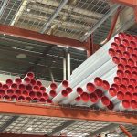 White kraft mailing tubes with red end caps