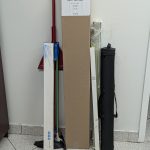 Utility/Rod/Gun 5 Panel Wrap leans against wall with typical long, narrow items that would go in it