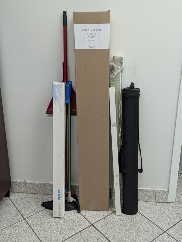 Utility/Rod/Gun 5 Panel Wrap leans against wall with typical long, narrow items that would go in it