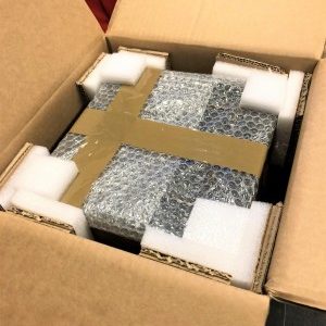 Box containing item with protective bubble wrapping, foam inserts