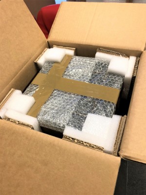 Box containing item with protective bubble wrapping, foam inserts