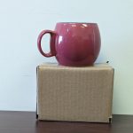 Coffee mug sits on top of a 6x4x4 inch stock box