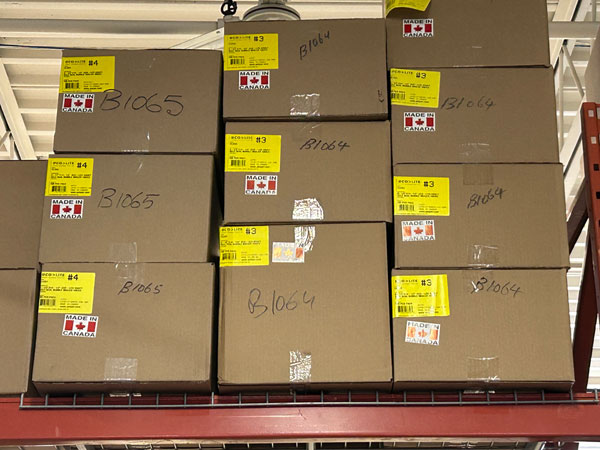 Boxes in GM Packaging retail store showing Made in Canada stickers