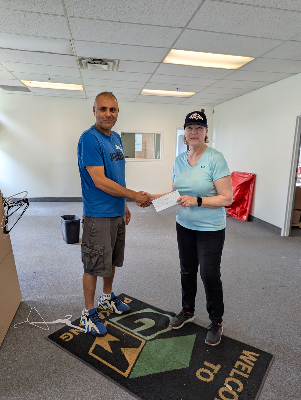 GM Packaging's Sue Goodwin thanks *the* Frank from Frank Team Demolition Services