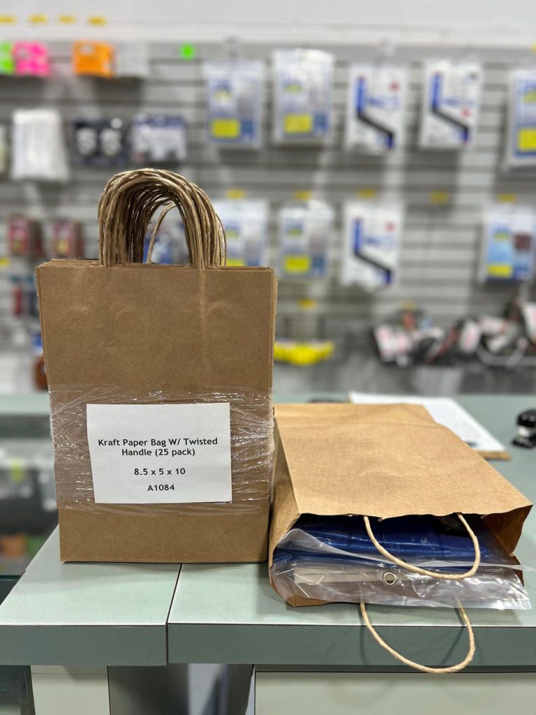 A1084 paper bag with handle, on front counter at GM Packaging