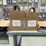 A1084 and A1085 paper bags with handles, on front counter at GM Packaging